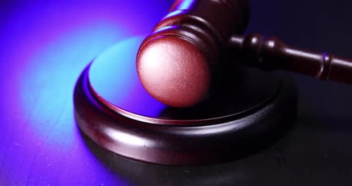 Wooden Gavel Close Up with Red Light