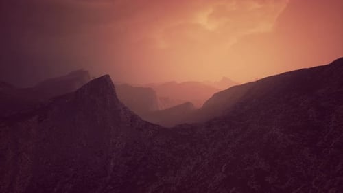 Dramatic Sky Over Rocky Mountains at Sunset