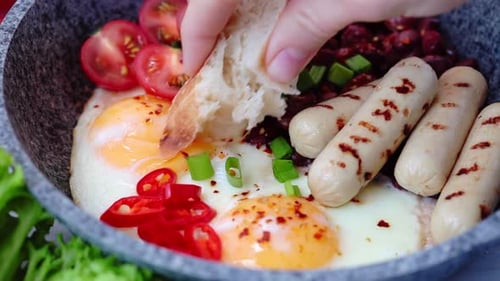 Hearty Breakfast with Eggs, Sausages, and Vegetables