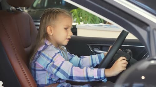 Cute Child Pretends to Drive a Car