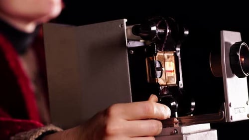 Hand Adjusting Focus on Antique Film Projector