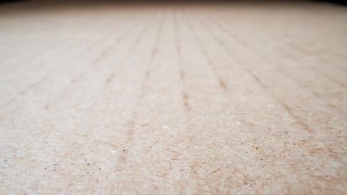 Close-Up of a Beige Textured Composite Surface