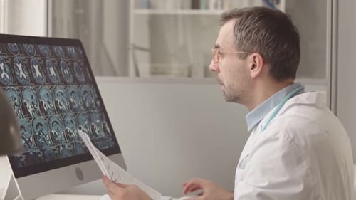 Radiologist Examining Patient Brain X Ray