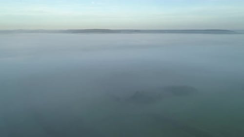 Aerial view of rural landscape with fog in autumn