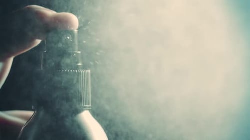 Close Up of Spray Bottle Dispensing Liquid