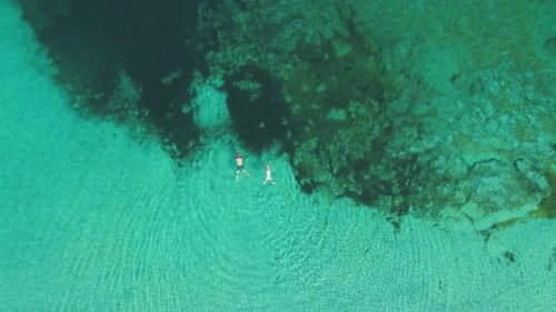 Transparent sea water near stony remote coast
