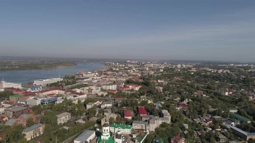 Aerial view of city with lots of trees and river 04