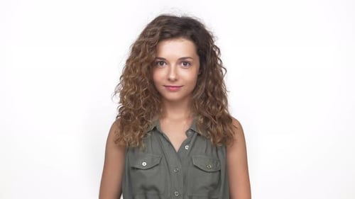 Young Woman Smiling and Giving Thumbs Up