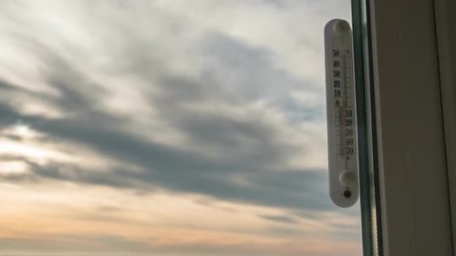 Sunset Time Lapse through Window with Thermometer