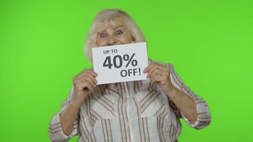 Senior Grandmother Showing Sale 40 Percent Off Banner Advertisement. Online Shopping. Black Friday