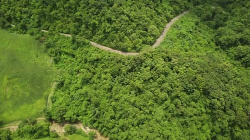 Aerial View of Countryside Road Passing Through the Mountain Landscape