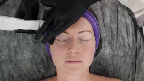 Woman Receiving Facial Treatment in a Doctor's Office