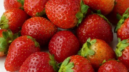 Rotation of juicy strawberries. Top view, Rotation 360 degrees, Extreme close up.