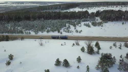 Truck And Car On Winter Country Road