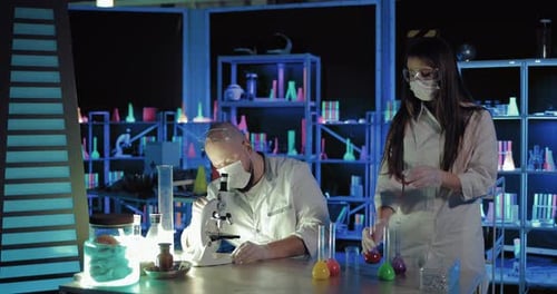 Scientists Conducting Experiment in Futuristic Laboratory at Night