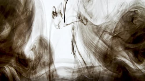 Black Color Ink in Water on White Background