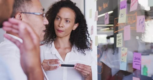 Team Discussing Business Strategy in Modern Office