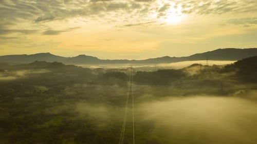 Aerial View of Mountains with Morning Mist at Sunrise