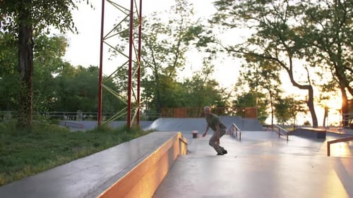 Skateboarder Doing a Tricks in a Concrete Skate Park