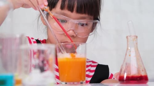 Child Engaged in Science Experiment at Home