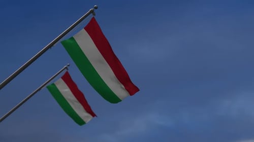 Waving Hungarian Flags Against Blue Sky