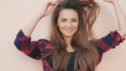 Portrait of beautiful smiling girl posing outdoors at summer sunny day
