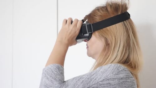 Woman Using Virtual Reality Headset in Bright Room