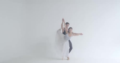 Ballet Couple Dancing in a White Studio