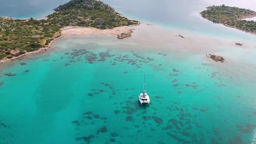 Aerial View of a Catamaran Yacht in the Blue Sea