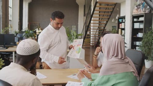 Diverse Team Collaborating on Business Presentation