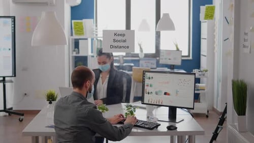Office Workers Maintain Social Distance During Pandemic