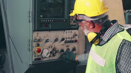 Senior Factory Worker Teach How to Use Machine Equipment in the Factory Workshop