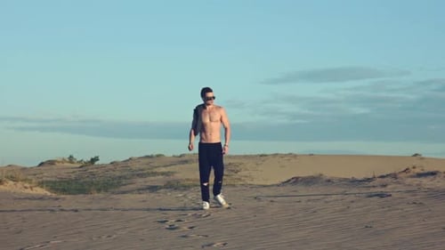 Sexy Man Going in Desert