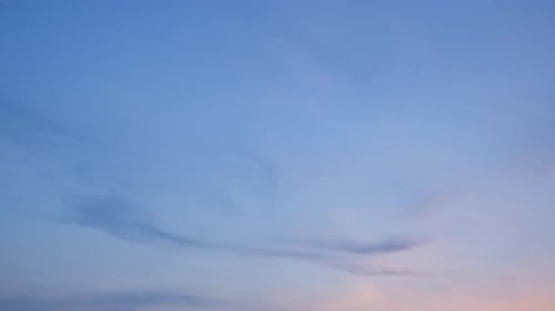 Majestic Clouds Drifting in Serene Pink Sky