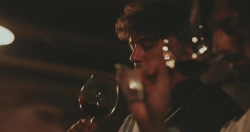 People Drinking Red Wine at Night