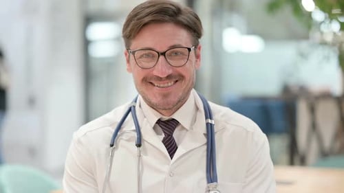 Smiling Adult Doctor Looking at the Camera