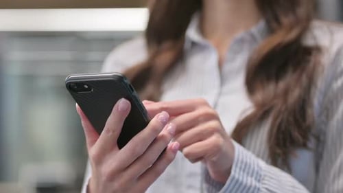 Close up of Young Woman Using Smartphone