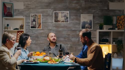 Family Dinner With Friends at Home Gathering