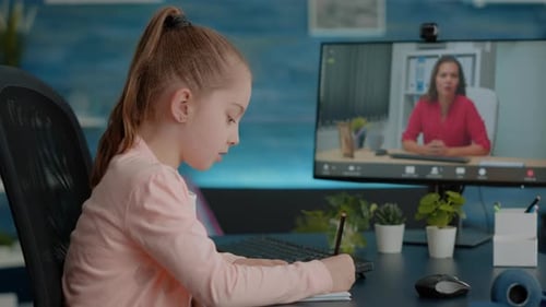 Girl Attends Online Class at Home