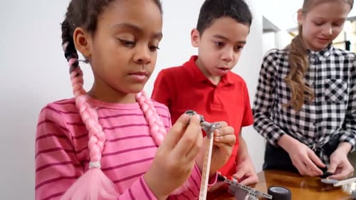 Kids Using Building Kit To Create Toys.