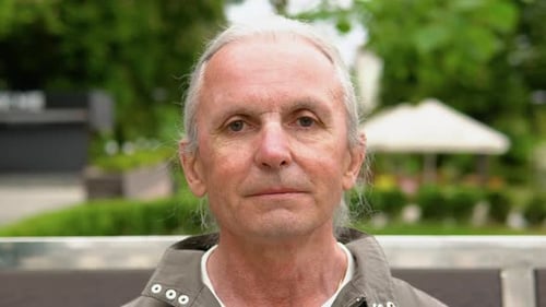 Adult Gray Haired Man Looking At Camera