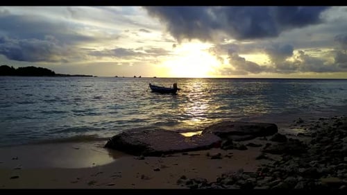 Aerial above panorama of tranquil shore beach adventure by blue sea with white sandy background of a