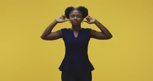 Woman Plugging Her Ears