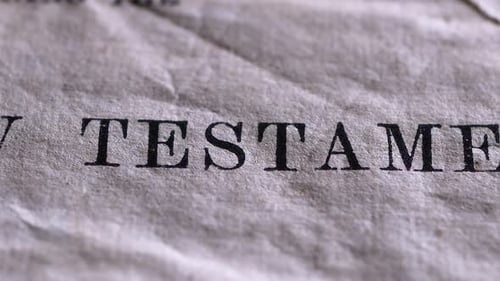 Close-up of New Testament Title on Paper