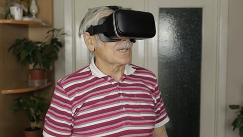Senior Man Interacting with Virtual Reality Headset