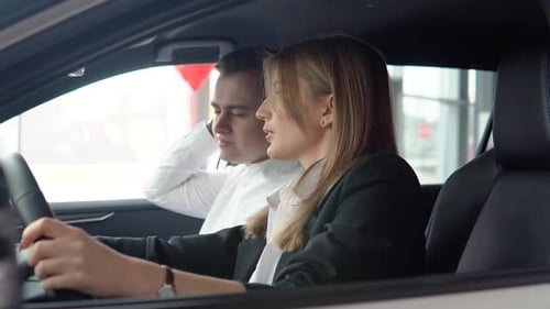 Young Woman Talking in Car with Male Passenger