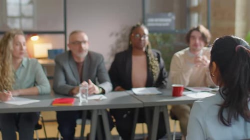 Candidate Interviewed by Panel in Bright Office Setting