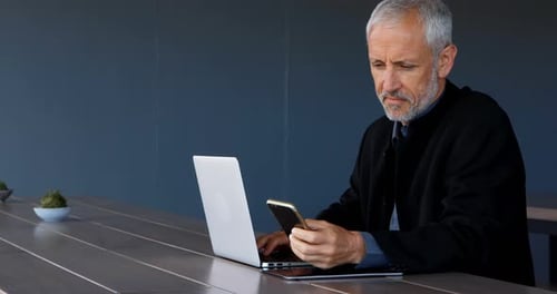 Businessman using mobile phone in hotel 4k