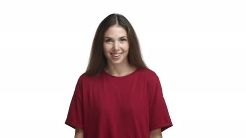 Smiling Woman Touches Chest in Thanks