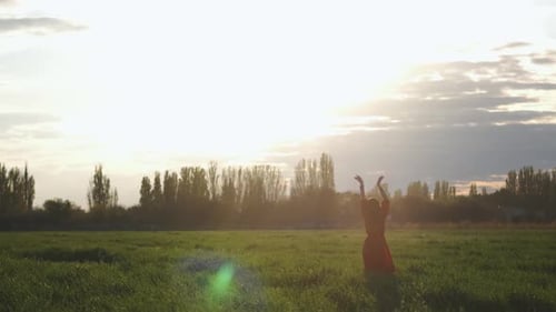 Beautiful Spanish Brunette Woman in Red Dress Dancing at Sunset in Wheat Field Slow Motion Shot